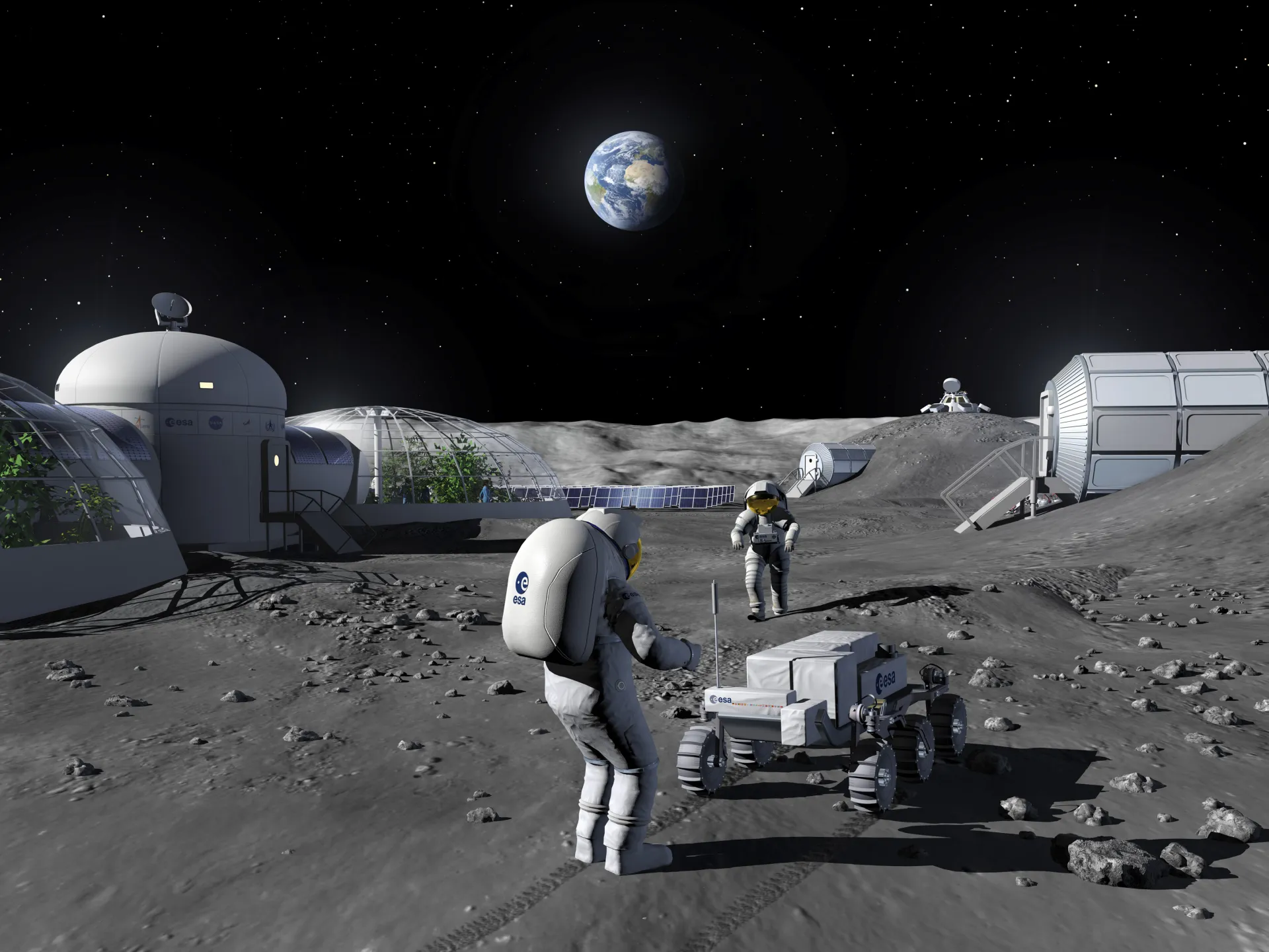 Two astronauts on the moon working with robot