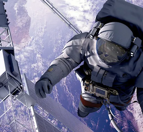 An astronaut close to a satellite